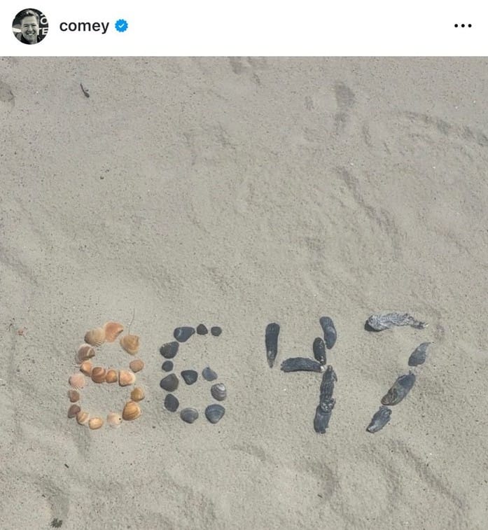 Seashells arranged to form the numbers "8647" on a beach